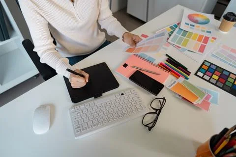 Creative graphic design process with color palettes, sketches, and digital tools Stock Photos