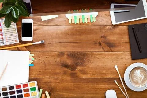 Creative graphic design workstation concept, computer paints on brown wood desk Stock Photos