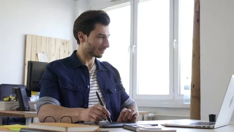 Creative graphic designer sketching on tablet, working at office Stock Footage 72871835