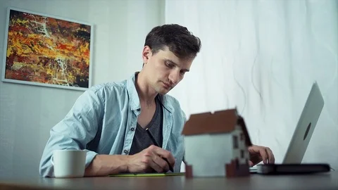Creative graphic designer sketching on tablet, working at home office Stock Footage 79902712