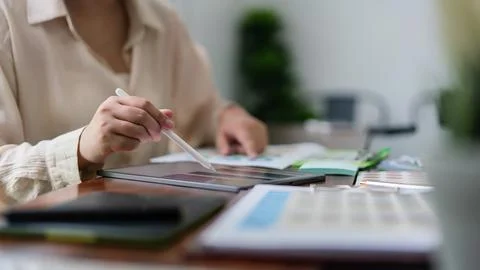 Creative graphic designer working about color swatch on tablet and document.. Foto stock
