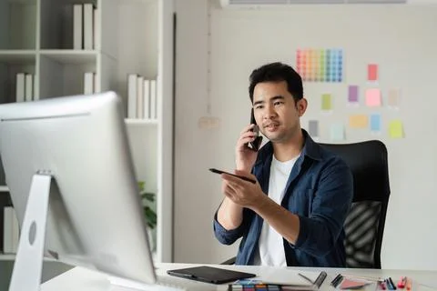 Creative Graphic Designer Working in Modern Design Studio with Digital Tools and Stock Photos