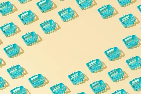 Creative grocery basket cart pattern flat lay on yellow background copy space 스톡 사진