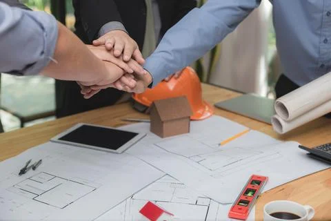 Creative group of engineer or architect meeting, discussion and putting hands Stock Photos
