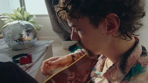 Creative Guy Playing the Guitar at Home Stock Footage 235660010