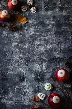 Creative Halloween background with themed marshmallows and apples. Place for  Stock Photos