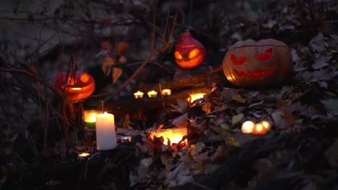 Creative Halloween carved pumpkins jack o lantern with burning candles inside Stock Footage 139201222