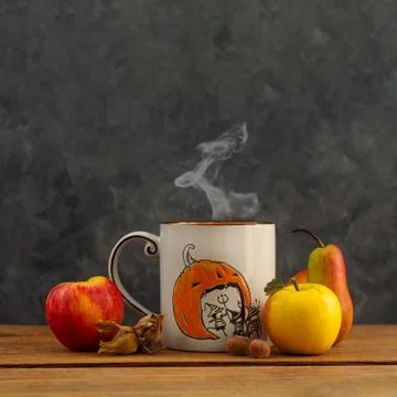Creative Halloween Day composition with coffee cup steam,fruits and nuts on d Stock Photos