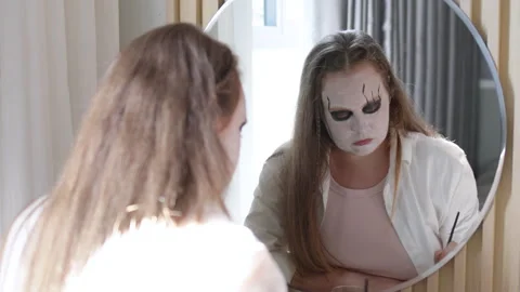 Creative Halloween makeup transformation featuring spooky doll look. Stock Footage 292610759