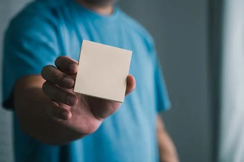 Creative hand with blank note indoor setting visual content simplistic view.. Stock Photos