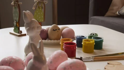 Creative Handmade Easter Eggs on Table near Paints and Brushes 库存影片 327888546