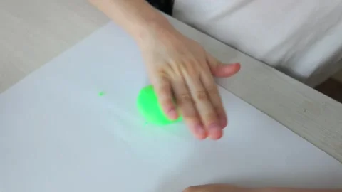 Creative Hands Engaged in the Joyful Art of Crafting with Green Modeling Clay Stock Footage 301692922