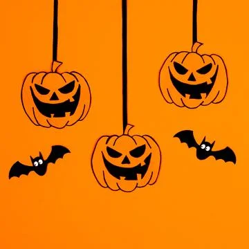 Creative hanging pumpkins with bats on orange background. Halloween concept.  Stock Illustration