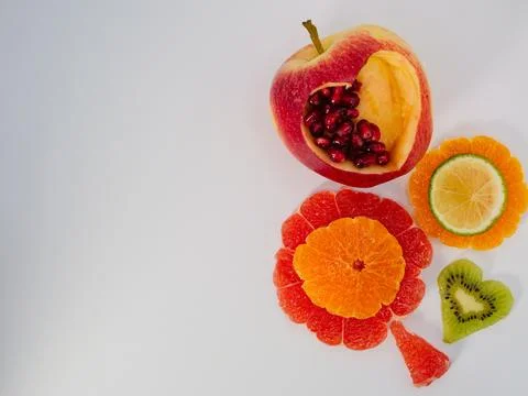 Creative healthy fruit composition with copy space on white background Stock Photos