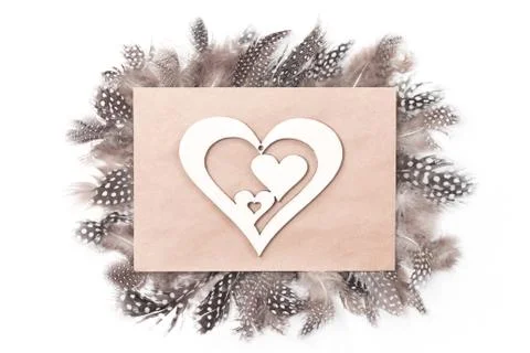 Creative hearts envelope with monochrome feathers, flat lay Stock Photos