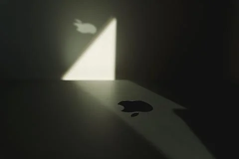 Creative highlighted Apple logo on macbook Stock Photos
