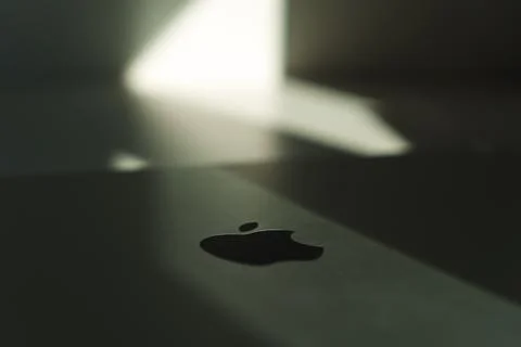 Creative highlighted Apple logo on macbook Stock Photos