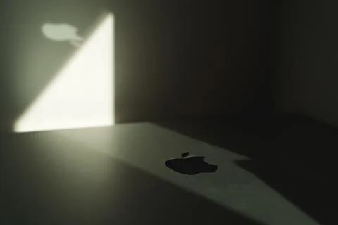 Creative highlighted Apple logo on macbook Stock Photos
