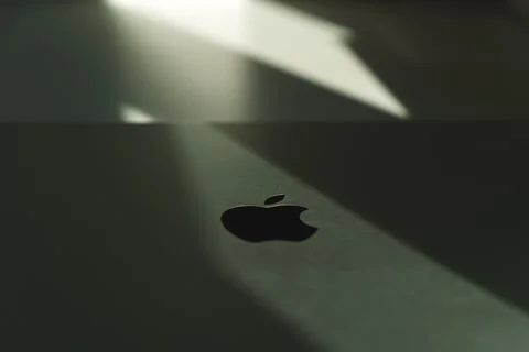 Creative highlighted Apple logo on macbook Stock Photos