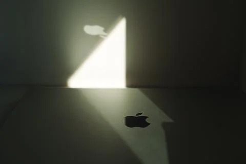Creative highlighted Apple logo on macbook Stock Photos