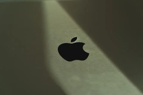 Creative highlighted Apple logo on macbook Stock Photos
