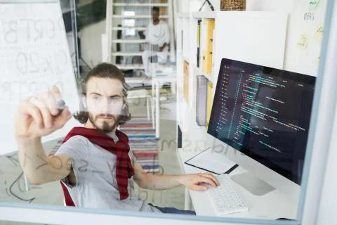 Creative hipster coder working with programming language Stock Photos