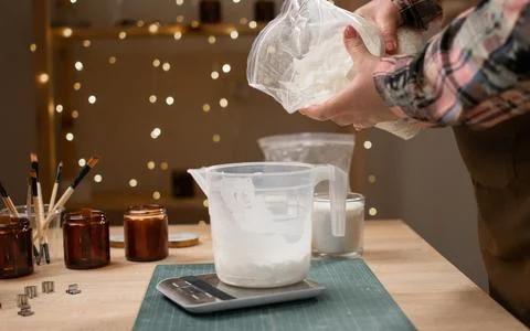 Creative hobby and candle making concept. Soy wax for making candles weigh .. Photos
