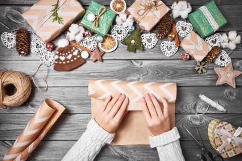 Creative hobby. Christmas presents with tools and decorations. Packing presen Stock Photos