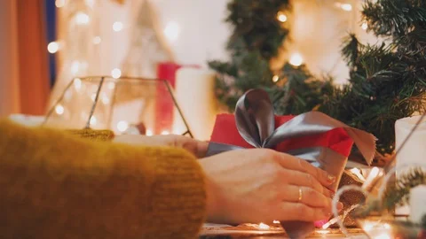 Creative hobby. Gift wrapping. Packaging modern christmas present boxes in Stock Footage 101739551