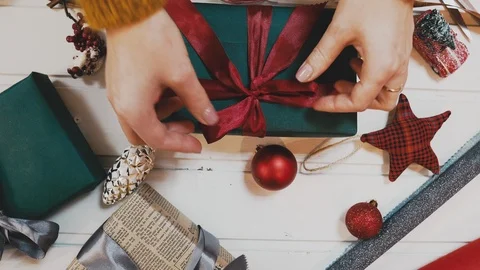 Creative hobby. Gift wrapping. Packaging modern christmas present boxes in Stock Footage 102878515