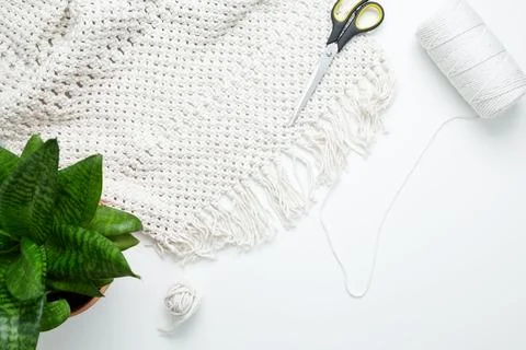 Creative hobby handmade macrame for home decoration. Weaving macrame at home. Stock Photos