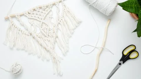 Creative hobby handmade macrame for home decoration. Weaving macrame at home. Stock Photos