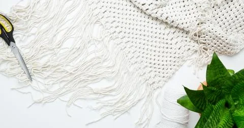 Creative hobby handmade macrame for home decoration. Weaving macrame at home. Stock Photos