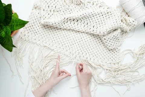 Creative hobby handmade macrame for home decoration. Girl weaves macrame. Wom Stock Photos