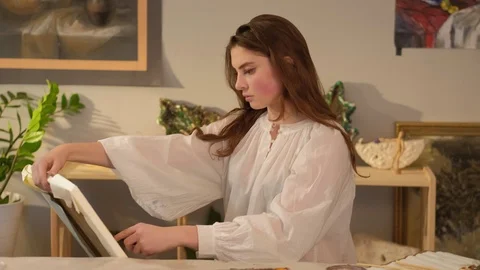 Creative hobby tender lefthanded artist painting Stock Footage 125911175