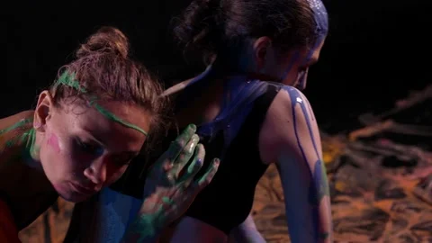 Creative hobby of two dancer women, ladies are dancing and smearing paints over Видео 169695793