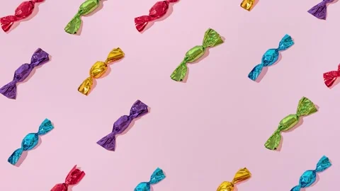 Creative Holiday party Pattern colorful Chocolates on Pink Background minimalism Stock Footage 331714859