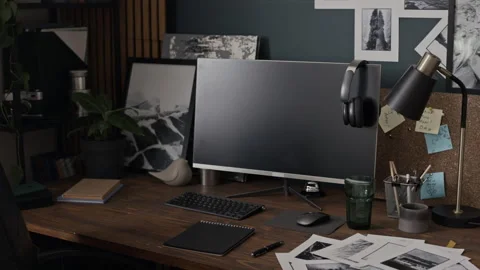 Creative Home Office Workspace Showing Computer with Photos on Desk Stock Footage 341397168