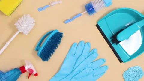 Creative household cleaning tools make pattern and move. Stop motion Stock Footage 151483387