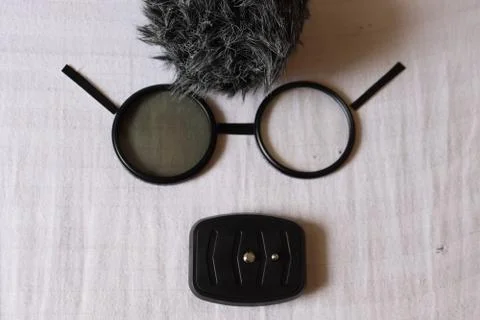 Creative human face artwork looking like a cartoon with glasses Stock Photos