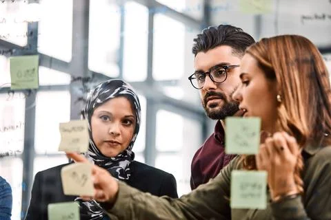 Creative, idea and group with sticky notes in office, point or brainstormin.. Stock Photos