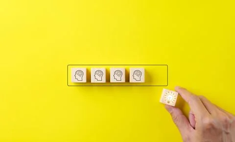 Creative idea and Knowledge innovation concept. Hand puts wooden blocks, Stock Photos