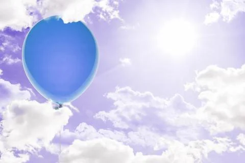 A creative idea of the balloon and the gift present box fly in the air Stock Photos