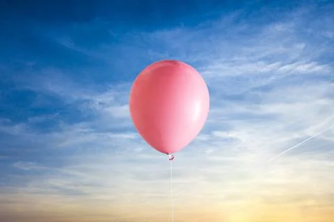 A creative idea of the balloon and the gift present box fly in the air Stock Photos