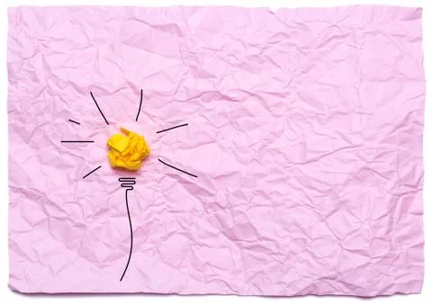 Creative idea with burning light bulb on a pink crumpled background. Educatio Stock Photos