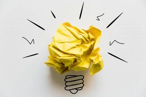 Creative idea. Concept of idea and innovation with yellow paper ball and ligh Stock Photos