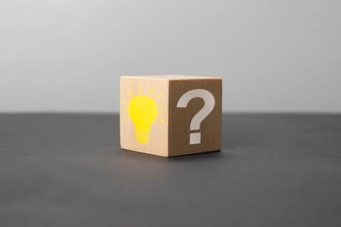 Creative idea, Innovation and Solution concepts. Wooden cube with light bulb  Stock Photos