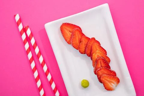 Creative image of fresh strawberries in the form of sushi rolls Stock Photos