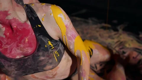 Creative improvisation with body paint. Body art with multi-colored paint. Slow Stock Footage 155374628