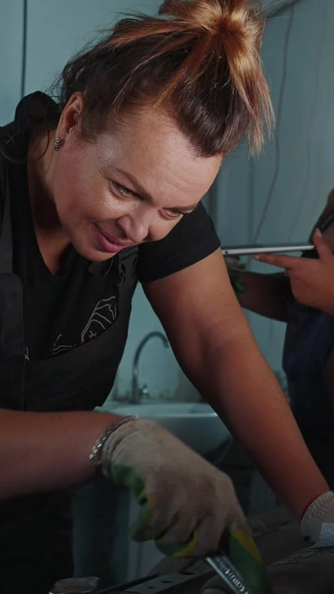 Creative individuals collaborating in a workspace on an innovative project 스톡 동영상 303803274